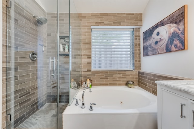 bathroom featuring vanity and plus walk in shower