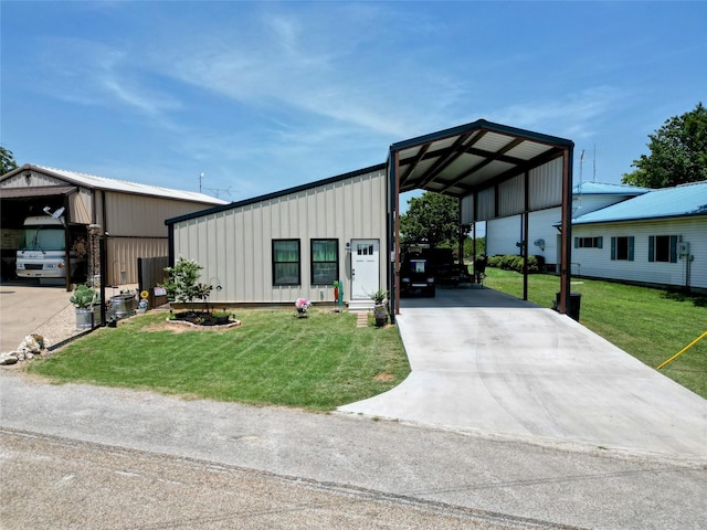 view of front facade with a carport and a front yard