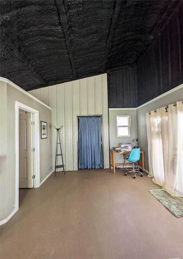 misc room featuring carpet and lofted ceiling