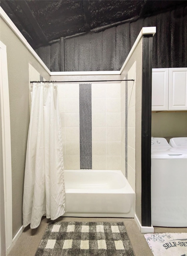 bathroom with separate washer and dryer and shower / tub combo with curtain