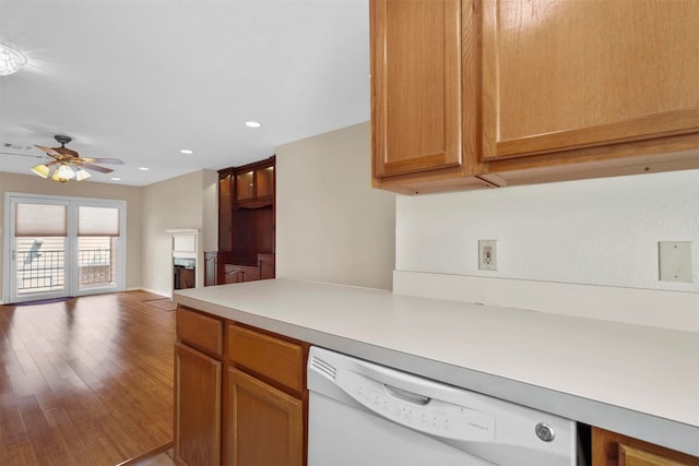 kitchen featuring wood-type flooring, white dishwasher, and ceiling fan