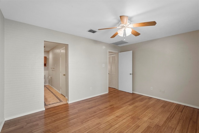 unfurnished room featuring light hardwood / wood-style flooring and ceiling fan