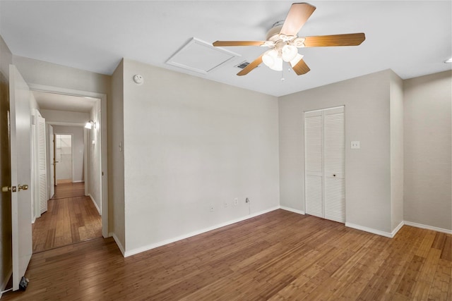 unfurnished room featuring ceiling fan and hardwood / wood-style floors