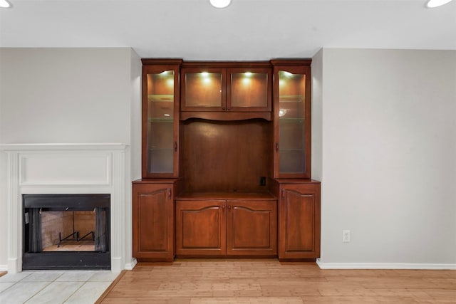 unfurnished living room with light wood-type flooring