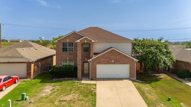 front facade featuring central AC unit, a garage, and a front lawn