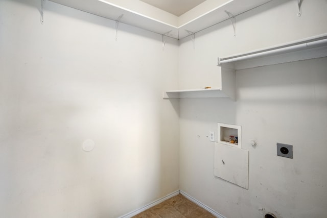 washroom with gas dryer hookup, tile patterned floors, hookup for an electric dryer, and hookup for a washing machine