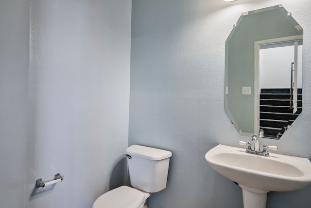 bathroom featuring sink and toilet