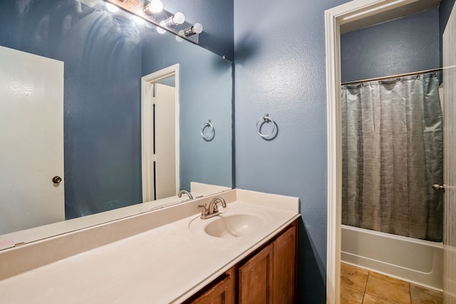 bathroom featuring vanity, tile patterned flooring, and shower / bath combo