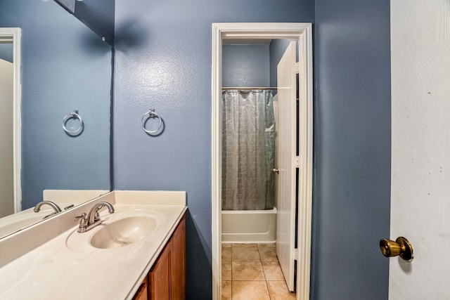 bathroom with tile patterned flooring, vanity, and shower / bathtub combination with curtain