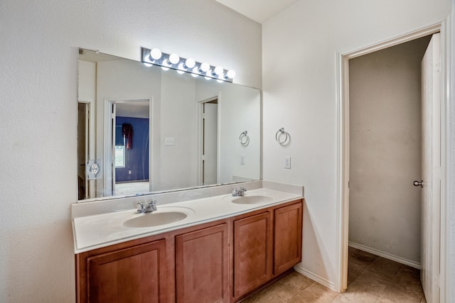 bathroom featuring double vanity and tile patterned floors