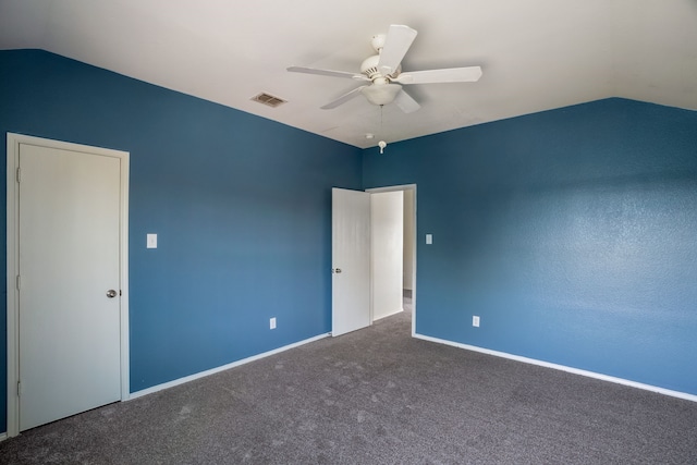 unfurnished bedroom featuring vaulted ceiling, carpet, and ceiling fan