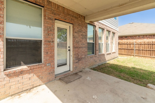 property entrance featuring a patio area