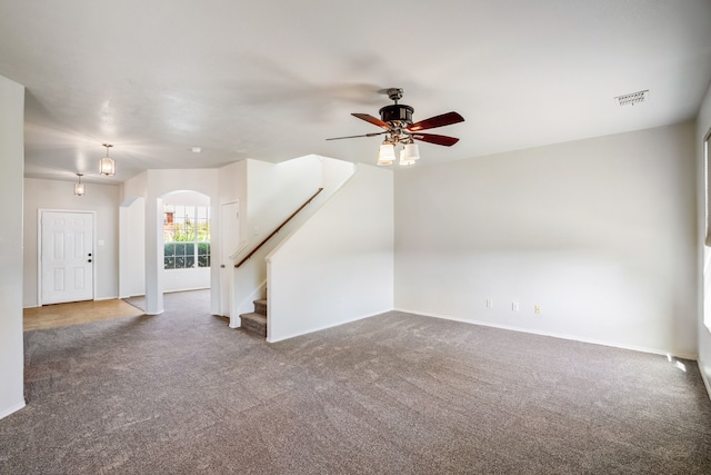 empty room with carpet flooring and ceiling fan