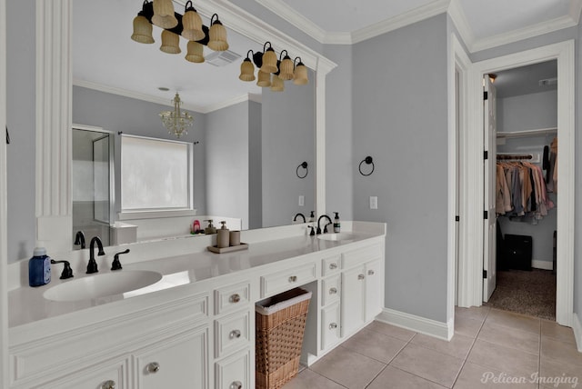 bathroom with tile patterned floors, vanity, a shower with door, crown molding, and a chandelier