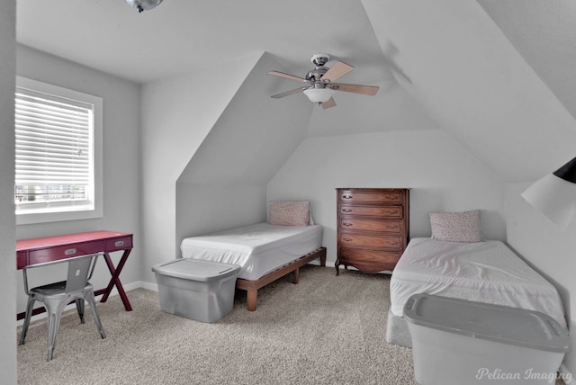 bedroom featuring light carpet, ceiling fan, and vaulted ceiling