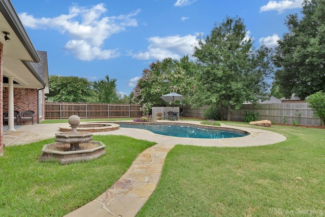 view of swimming pool with a yard and a patio