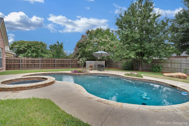 view of swimming pool with an in ground hot tub and a patio