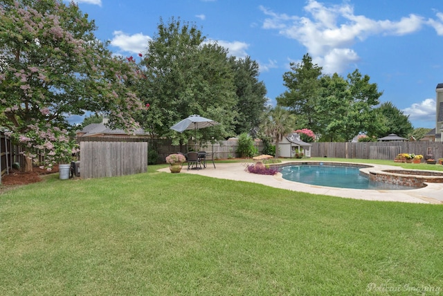 view of pool with a yard and a patio