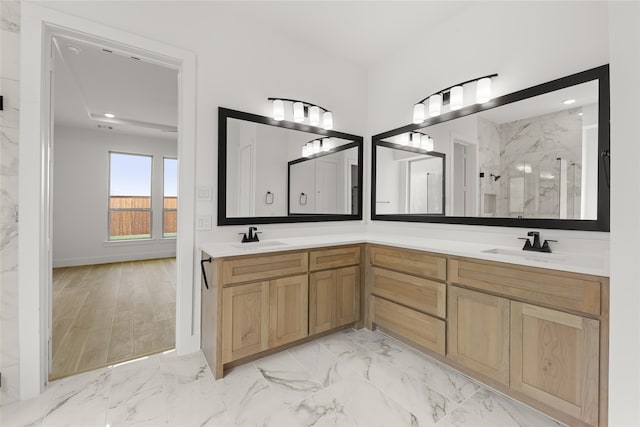 bathroom featuring vanity and a tile shower