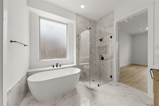 bathroom featuring separate shower and tub, hardwood / wood-style flooring, and vanity