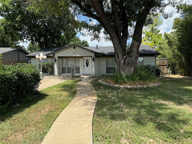 ranch-style house with a front yard