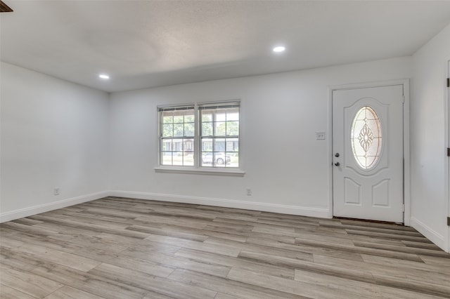 foyer entrance with light hardwood / wood-style flooring