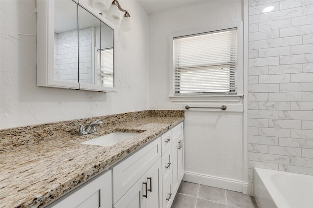 bathroom with tile patterned flooring and vanity