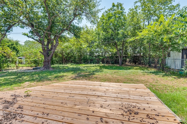 wooden terrace with a yard