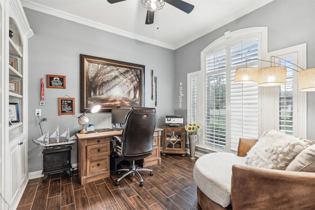 home office featuring ceiling fan, built in shelves, a wood stove, ornamental molding, and dark wood-type flooring