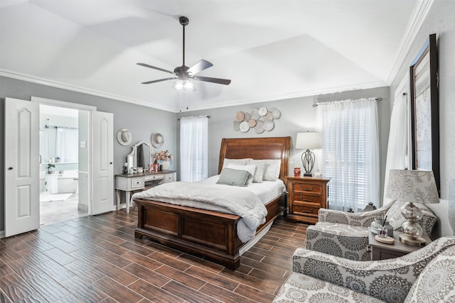 bedroom with crown molding, connected bathroom, dark hardwood / wood-style flooring, ceiling fan, and vaulted ceiling