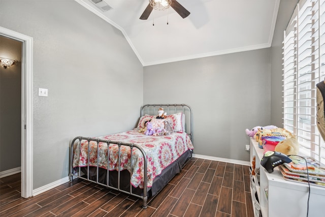 bedroom with ceiling fan, dark wood-type flooring, vaulted ceiling, and ornamental molding