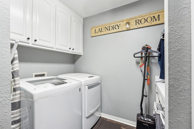 laundry area featuring cabinets and washing machine and dryer