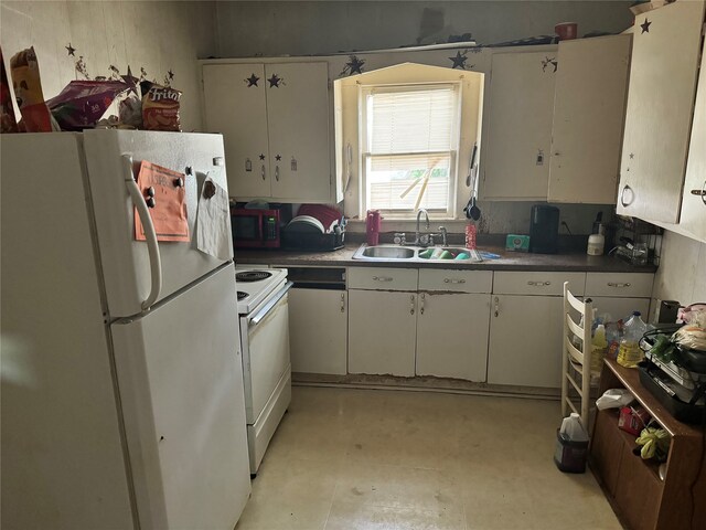 kitchen with sink, white appliances, and white cabinets