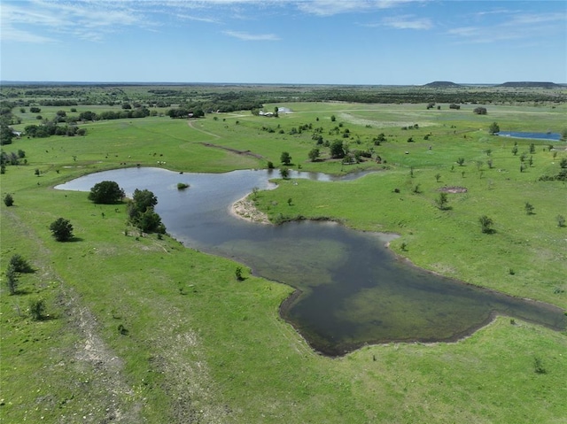 birds eye view of property with a rural view and a water view