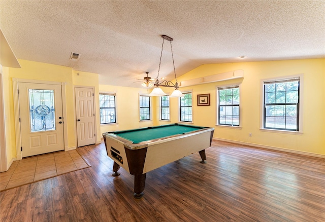 rec room with pool table, vaulted ceiling, hardwood / wood-style floors, and a textured ceiling