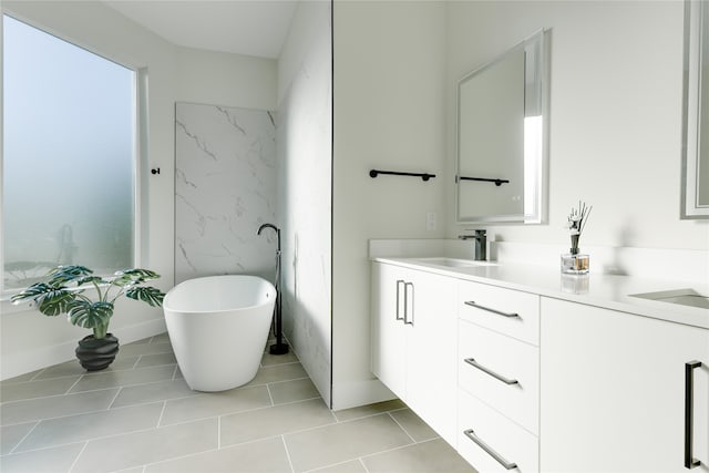 bathroom featuring vanity, a tub to relax in, and tile patterned floors