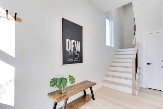 staircase with wood-type flooring