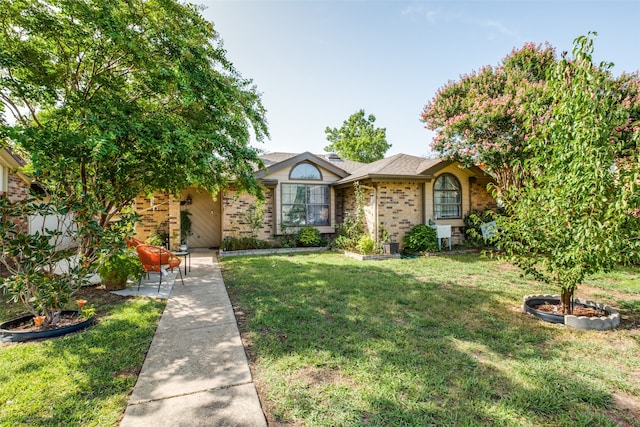 ranch-style home with a front yard