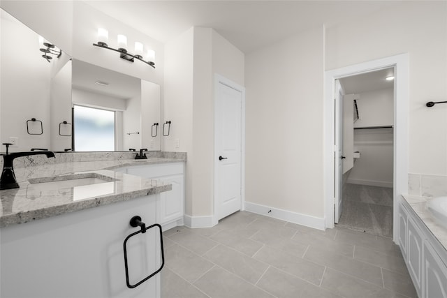 bathroom with tile patterned flooring and vanity