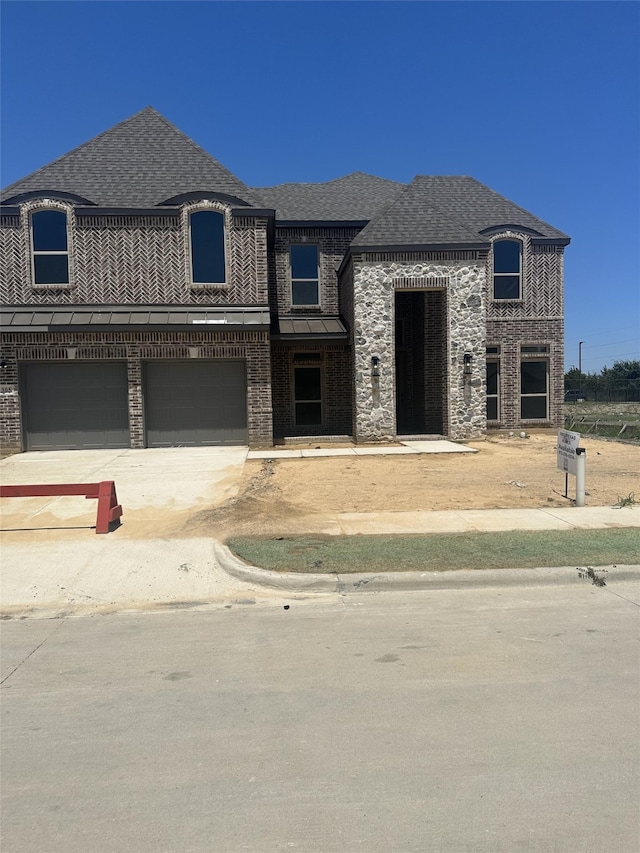 view of front of home with a garage