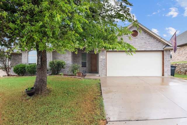 view of front of house with a garage and a front yard