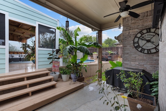 view of patio / terrace with ceiling fan, fence, and a grill