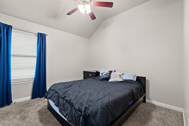 bedroom featuring lofted ceiling, ceiling fan, baseboards, and carpet flooring