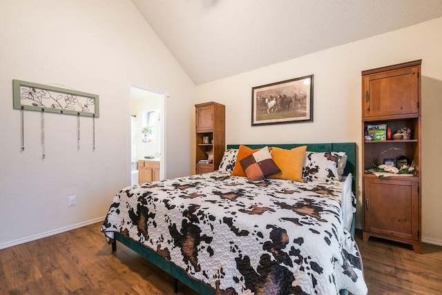 bedroom with dark wood finished floors, connected bathroom, baseboards, and high vaulted ceiling