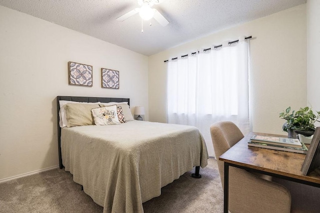 bedroom with carpet, a textured ceiling, a ceiling fan, and baseboards