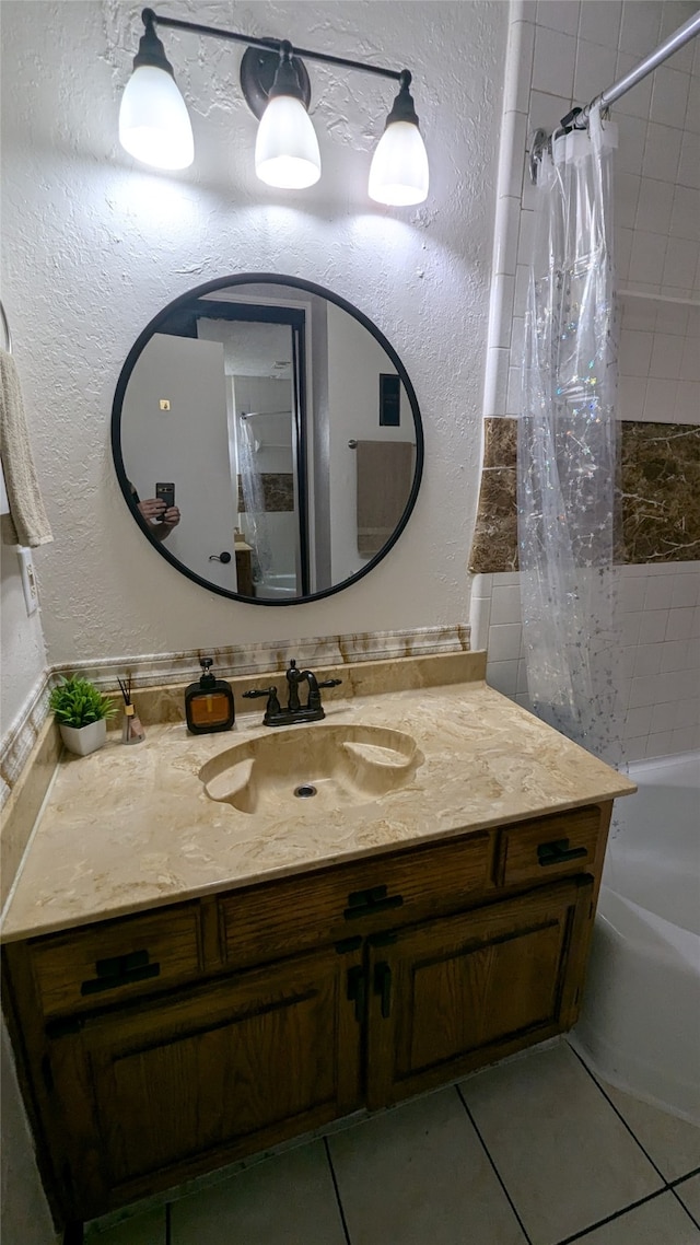 bathroom featuring vanity, shower / bath combination with curtain, and tile patterned flooring