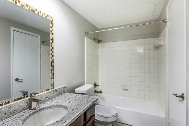 full bathroom featuring vanity, toilet, and tiled shower / bath