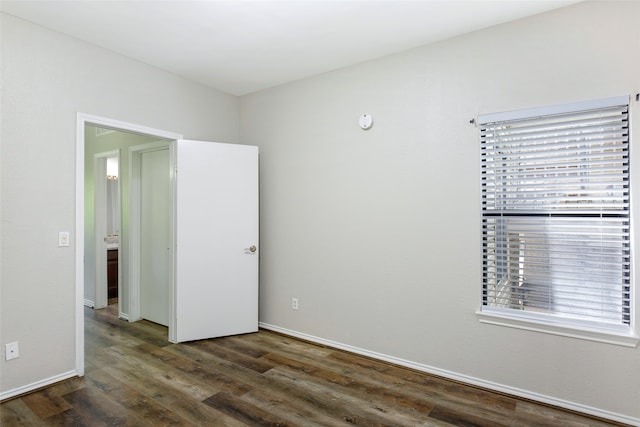 unfurnished room featuring dark hardwood / wood-style floors