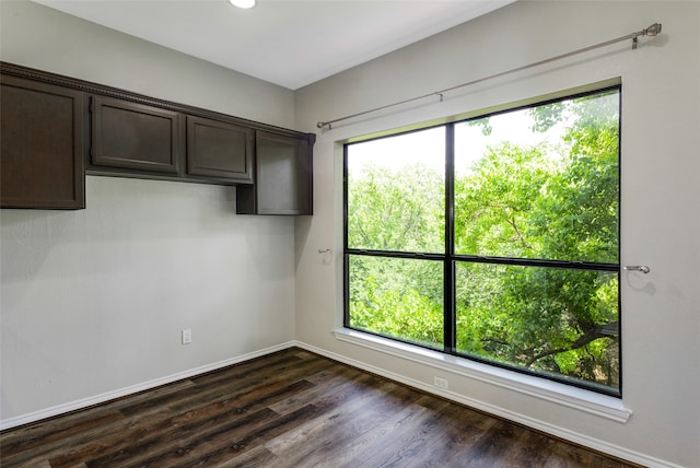 empty room featuring dark hardwood / wood-style flooring