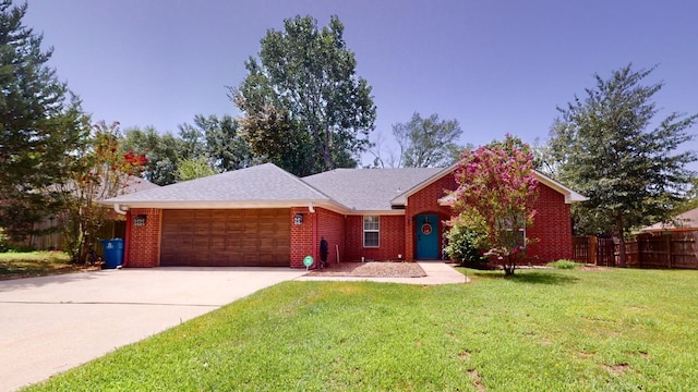 ranch-style house with a garage and a front yard